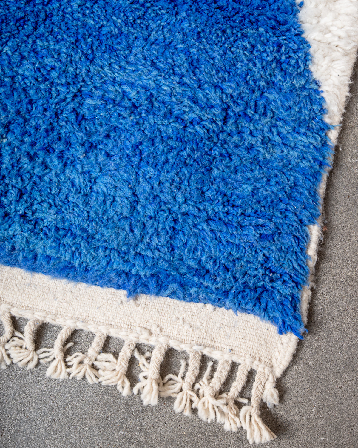 Modern, designer, handcrafted Berber rug from Morocco. Beniourain carpet with beautiful colours and patterns and fluffy wool texture.